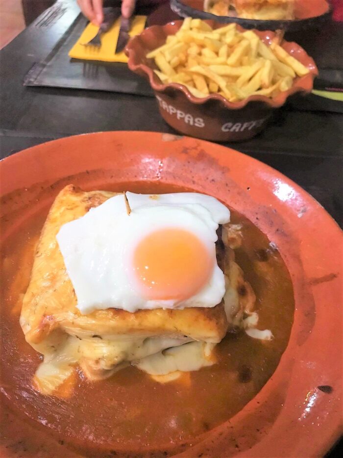 Francesinha cooked in a wood oven